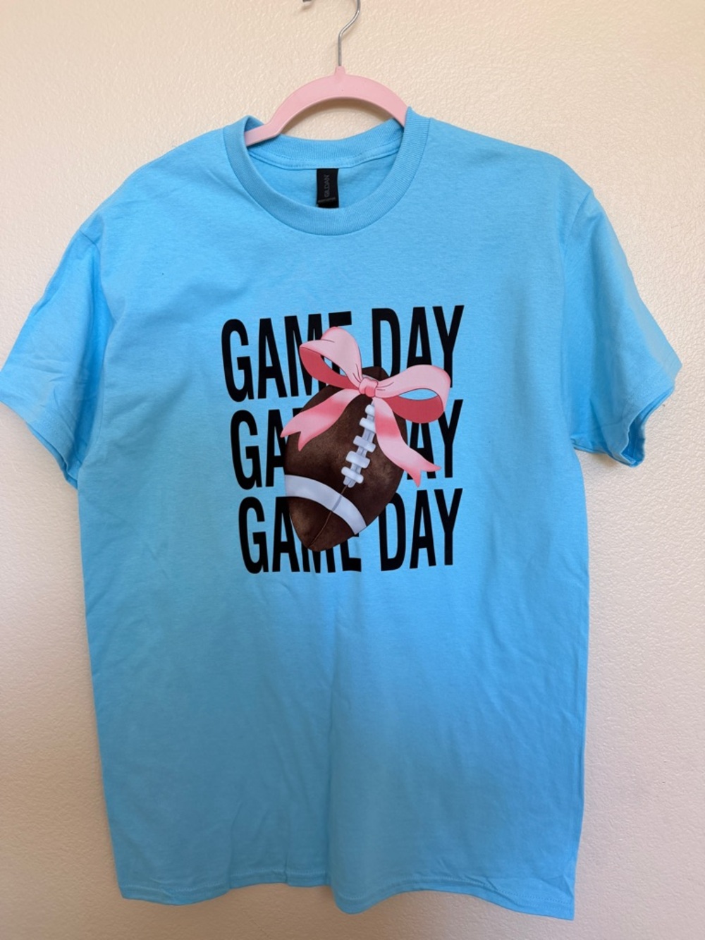 Gildan Light Blue Tee with Pink Bow Football Graphic